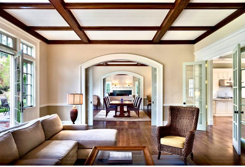 Living room with a coffered ceiling and French doors, with the dining room beyond at 5020 Iselin Avenue, Riverdale — photo 4 of 7