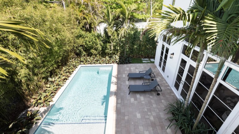 pool and rear terrace at 505 Zamora Avenue