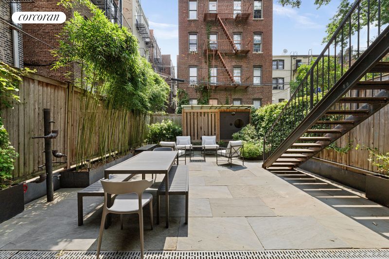 Landscaped bluestone garden and deck stairs at 506 13th Street, Park Slope — photo 4 of 10