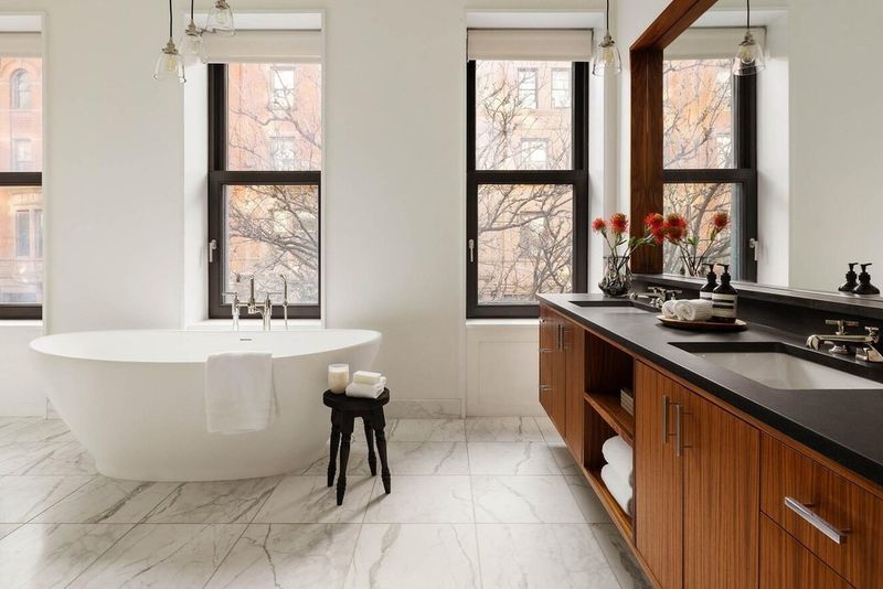 Marble primary bath with freestanding tub at 53 West 71st Street, Upper West Side — photo 7 of 7