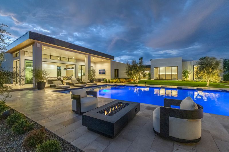 Fire-pit lounge twilight at 5441 E Via Buena Vista, Paradise Valley — photo 2 of 10