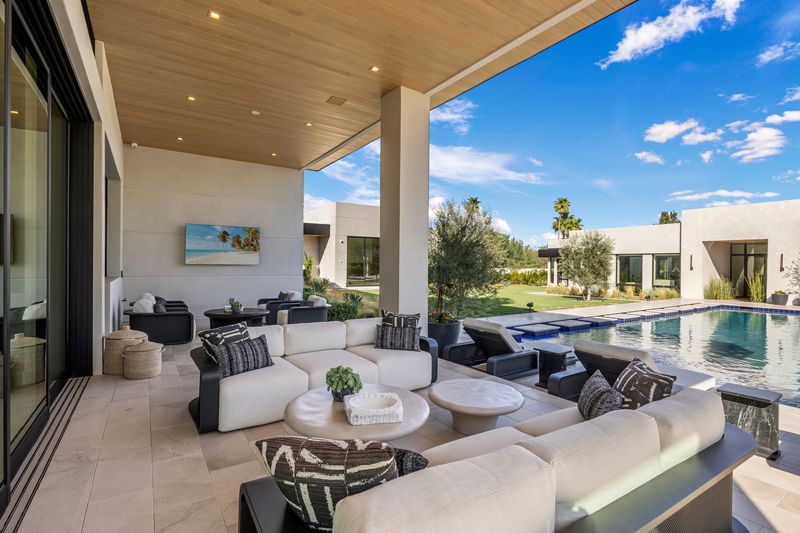 Covered patio lounge at 5441 E Via Buena Vista, Paradise Valley — photo 6 of 10