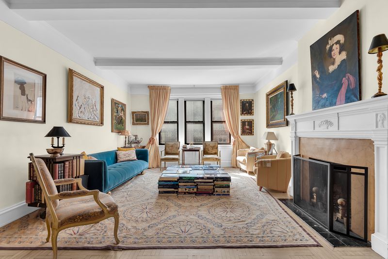 Drawing room with a wood-burning fireplace at 55 East 86th Street 8B, Carnegie Hill