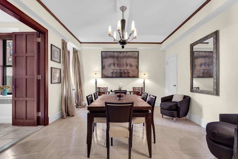 Formal dining room through the French doors at 55 East 86th Street 8B, Carnegie Hill — photo 9 of 9