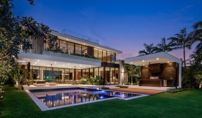 dusk pool outdoor kitchen at 5515 Pine Tree Drive