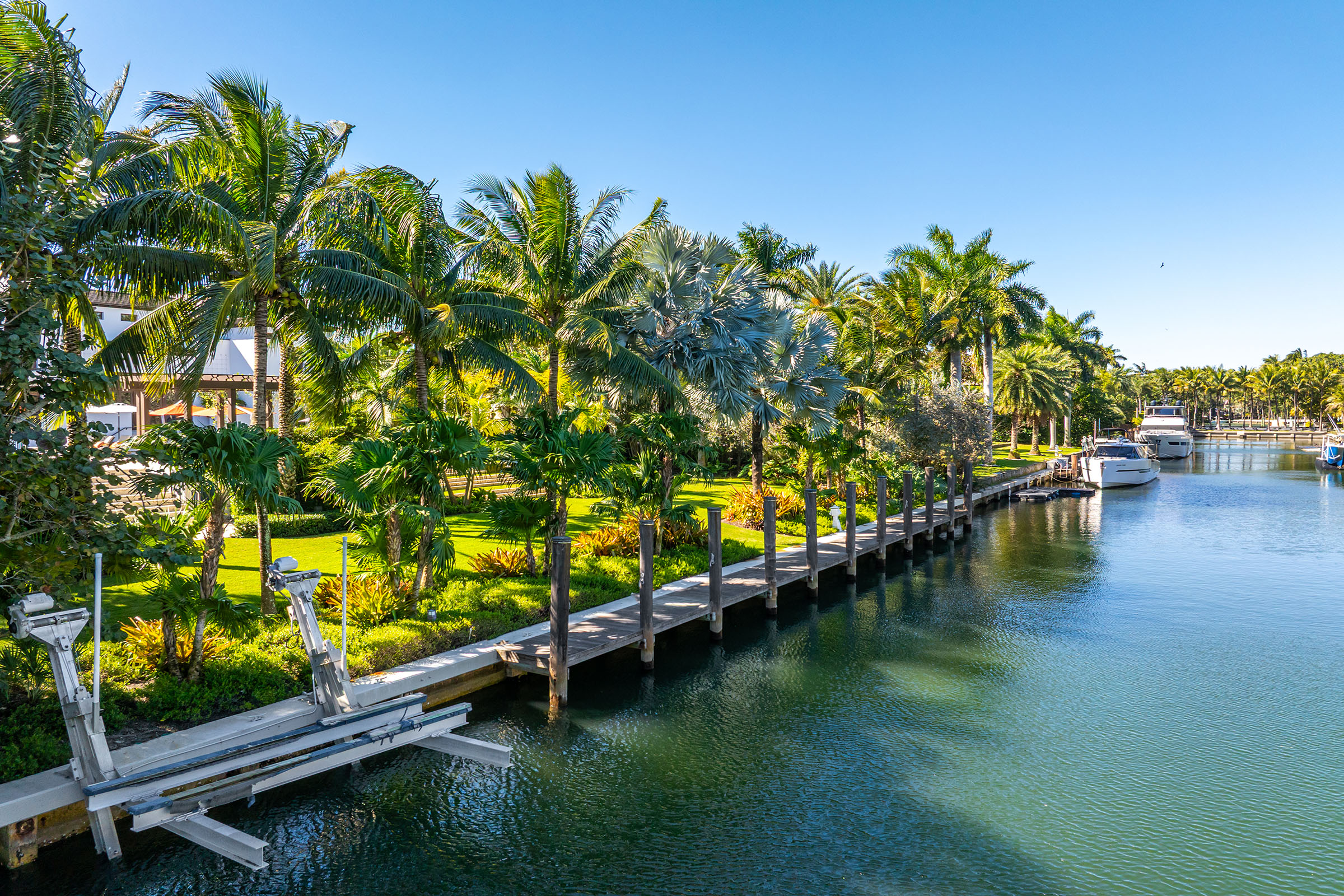 waterfront, dock, and boat lift at 555 Arvida Parkway