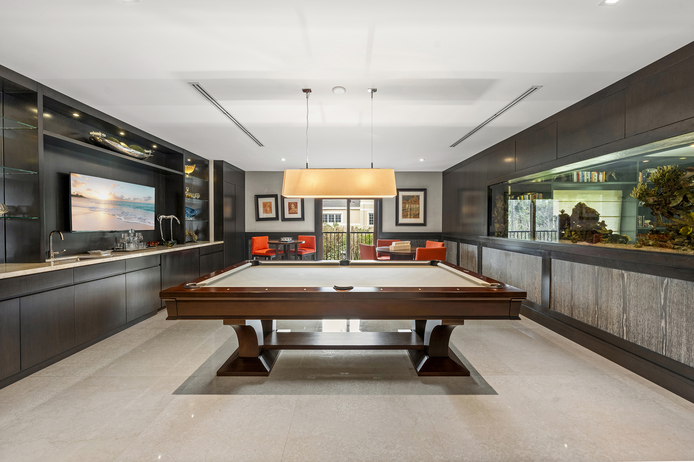 billiard room with aquarium wall at 555 Arvida Parkway
