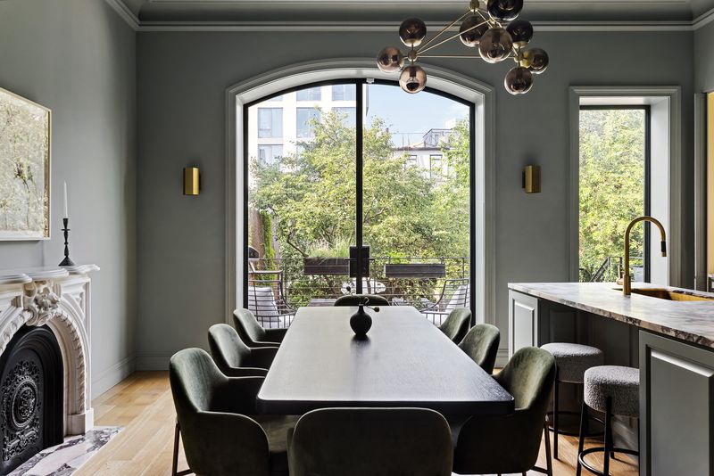 Parlor-floor dining room and kitchen under arched garden windows at 59 Lefferts Place, Clinton Hill