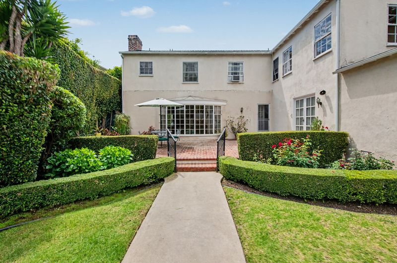Rear facade with French doors to the patio at 608 Trenton Drive, Beverly Hills Flats — photo 5 of 10