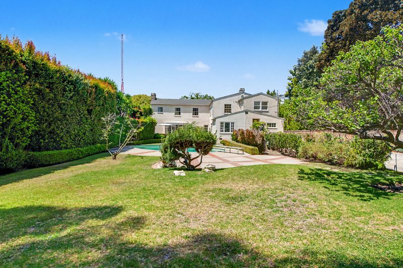 Back lawn toward the house and pool at 608 Trenton Drive, Beverly Hills Flats — photo 6 of 10