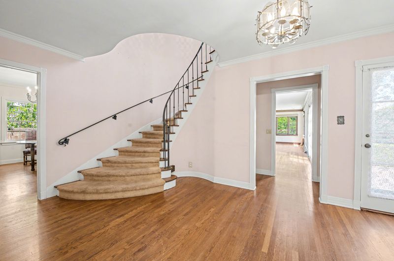 Formal entry with a sweeping staircase at 608 Trenton Drive, Beverly Hills Flats — photo 9 of 10