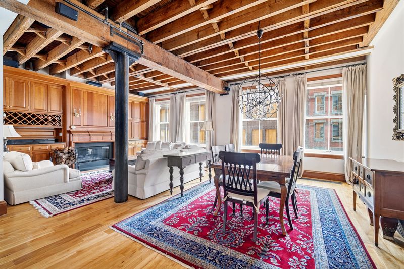 Great room toward dining and fireplace at 61 North Moore Street 3W, Tribeca — photo 2 of 5