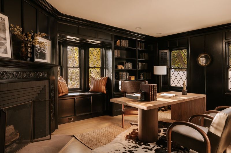 The paneled library, with built-in shelving and leaded-glass windows at 628 North Sierra Drive, Beverly Hills — photo 5 of 8