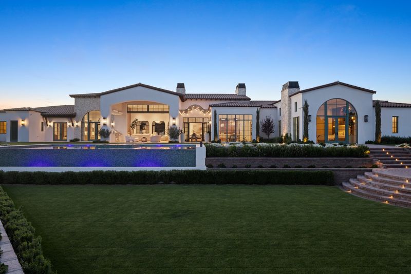 Rear facade pool dusk at 6541 N 48th St, Paradise Valley — photo 2 of 10