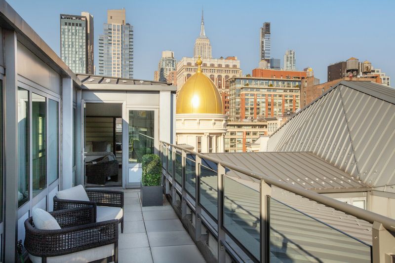 Terrace and gold cupola against the skyline at 655 Sixth Avenue PHB, Chelsea