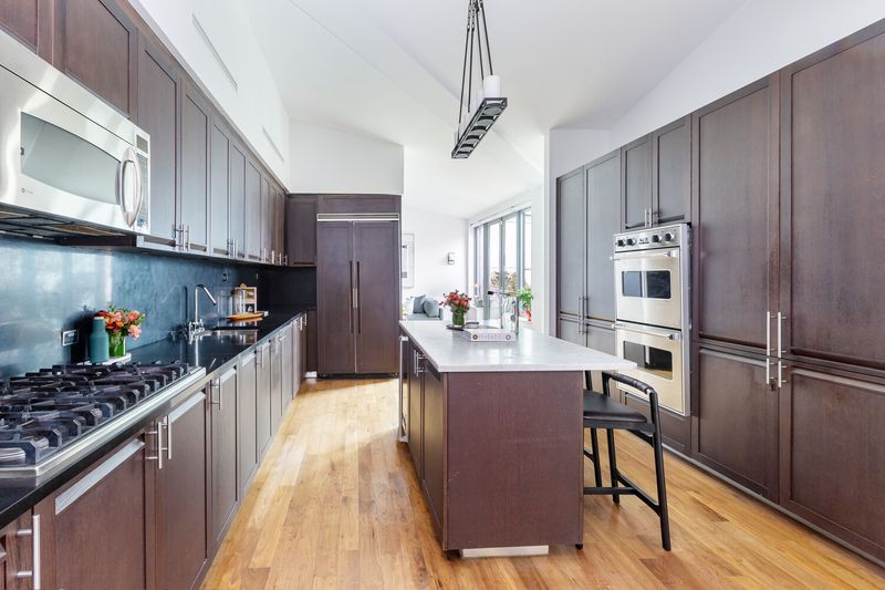 Kitchen with center island at 655 Sixth Avenue PHB, Chelsea — photo 5 of 8