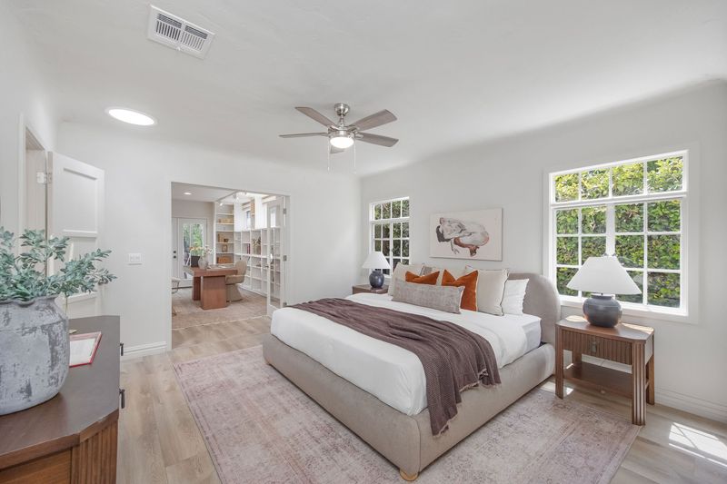 Bright bedroom with divided-light windows at 718 Westbourne Drive, West Hollywood — photo 5 of 5