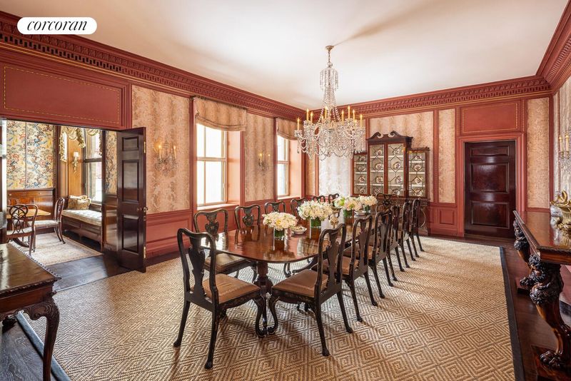 Formal dining room under a crystal chandelier at 740 Park Avenue 6/7D, Lenox Hill — photo 3 of 12