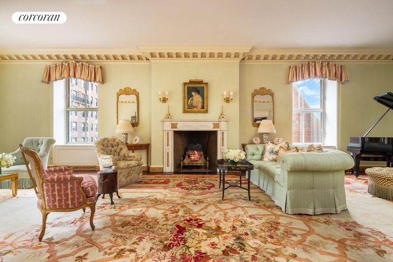 Living room seating area and fireplace wall at 740 Park Avenue 6/7D, Lenox Hill — photo 5 of 12