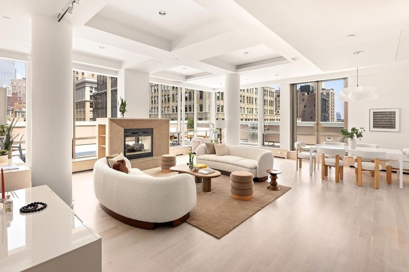 Great room with fireplace and floor-to-ceiling windows at 76 Madison Avenue PH1, NoMad