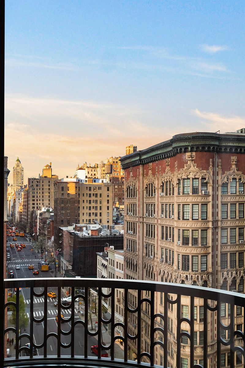 Balcony view over the neighborhood at sunset at 760 Madison Avenue, Ninth Floor, Lenox Hill — photo 6 of 6