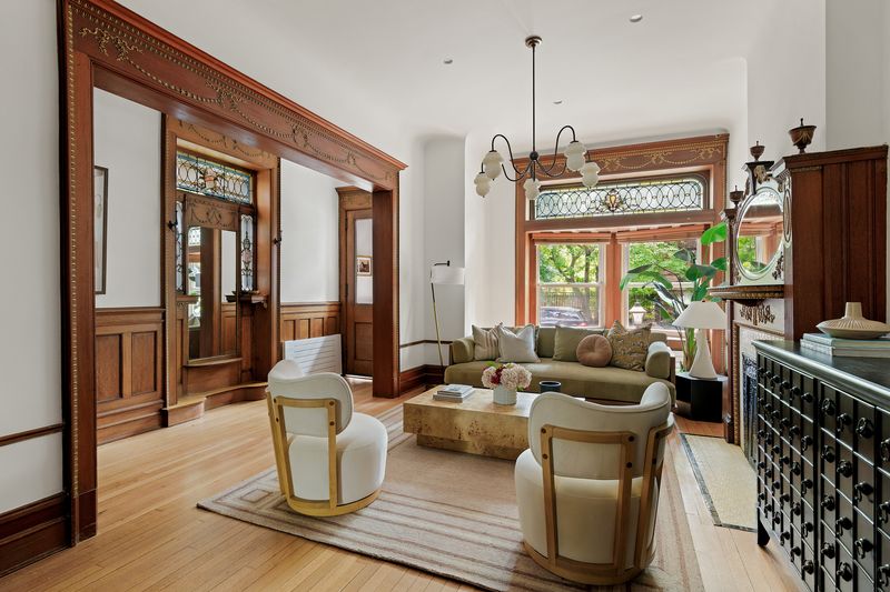 Parlor floor through the original pocket-door frame at 8 Polhemus Place, Park Slope — photo 2 of 12