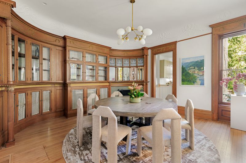 Dining room with curved built-in glass cabinetry at 8 Polhemus Place, Park Slope — photo 4 of 12