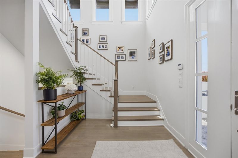 Entry stair hall with gallery wall at 826 18th Street, Hermosa Beach — photo 3 of 8