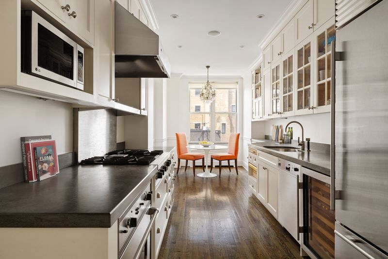 Windowed eat-in kitchen with professional range and soapstone counters at 876 Park Avenue 9N, Upper East Side