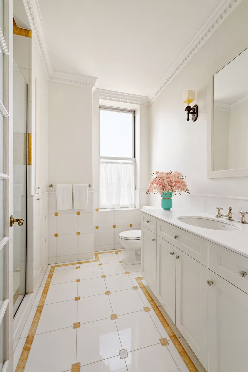 Marble bath with glass shower at 876 Park Avenue 9N, Upper East Side — photo 4 of 12