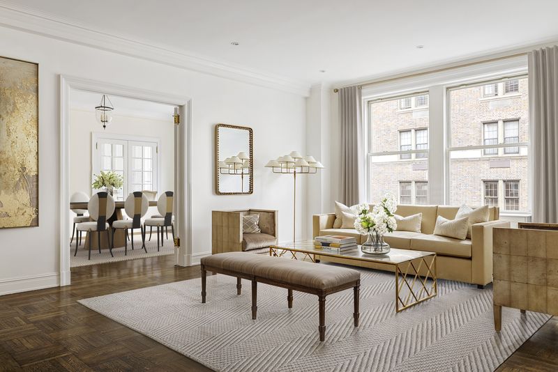 Living room with oversized windows at 876 Park Avenue 9N, Upper East Side — photo 11 of 12