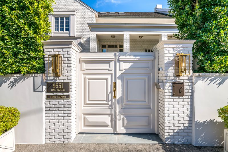 Paneled white double-door entry at 9551 Lime Orchard Road, Beverly Hills — photo 2 of 8