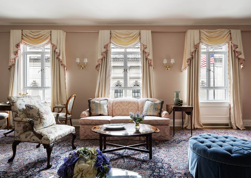 Living room seating beneath swagged windows facing the Met at 993 Fifth Avenue, Residence 4, Upper East Side — photo 2 of 12