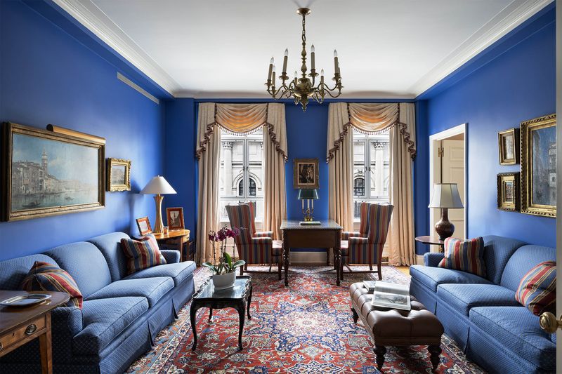 Blue library with gilt-framed art at 993 Fifth Avenue, Residence 4, Upper East Side — photo 3 of 12