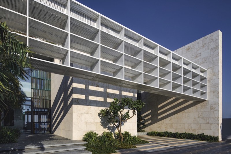 entry court, white grid canopy, stone facade